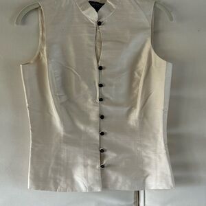 Elegant Sleeveless Cream Blouse with Black Buttons
